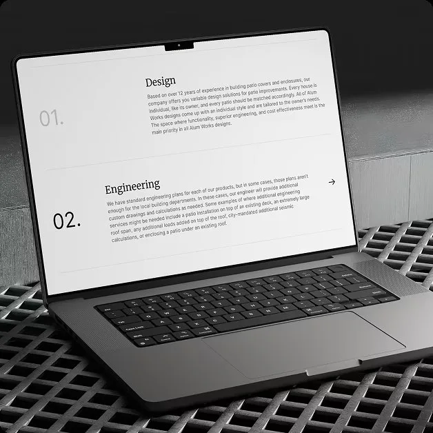The Alum Works process section on a MacBook angled on dark steel grating, showing the numbered steps "01. Design" and "02. Engineering" with their explanatory copy.