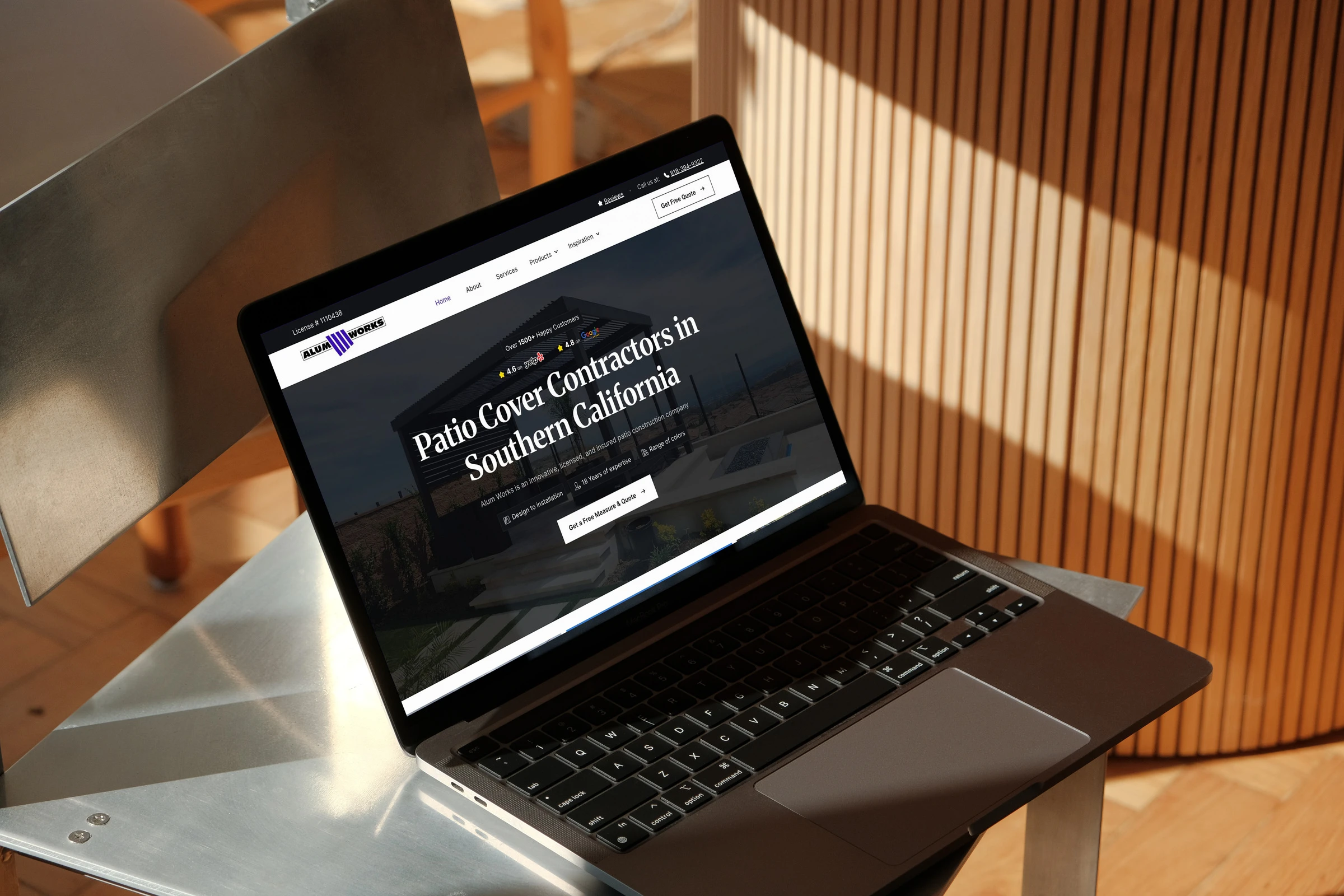 Alum Works website on a laptop