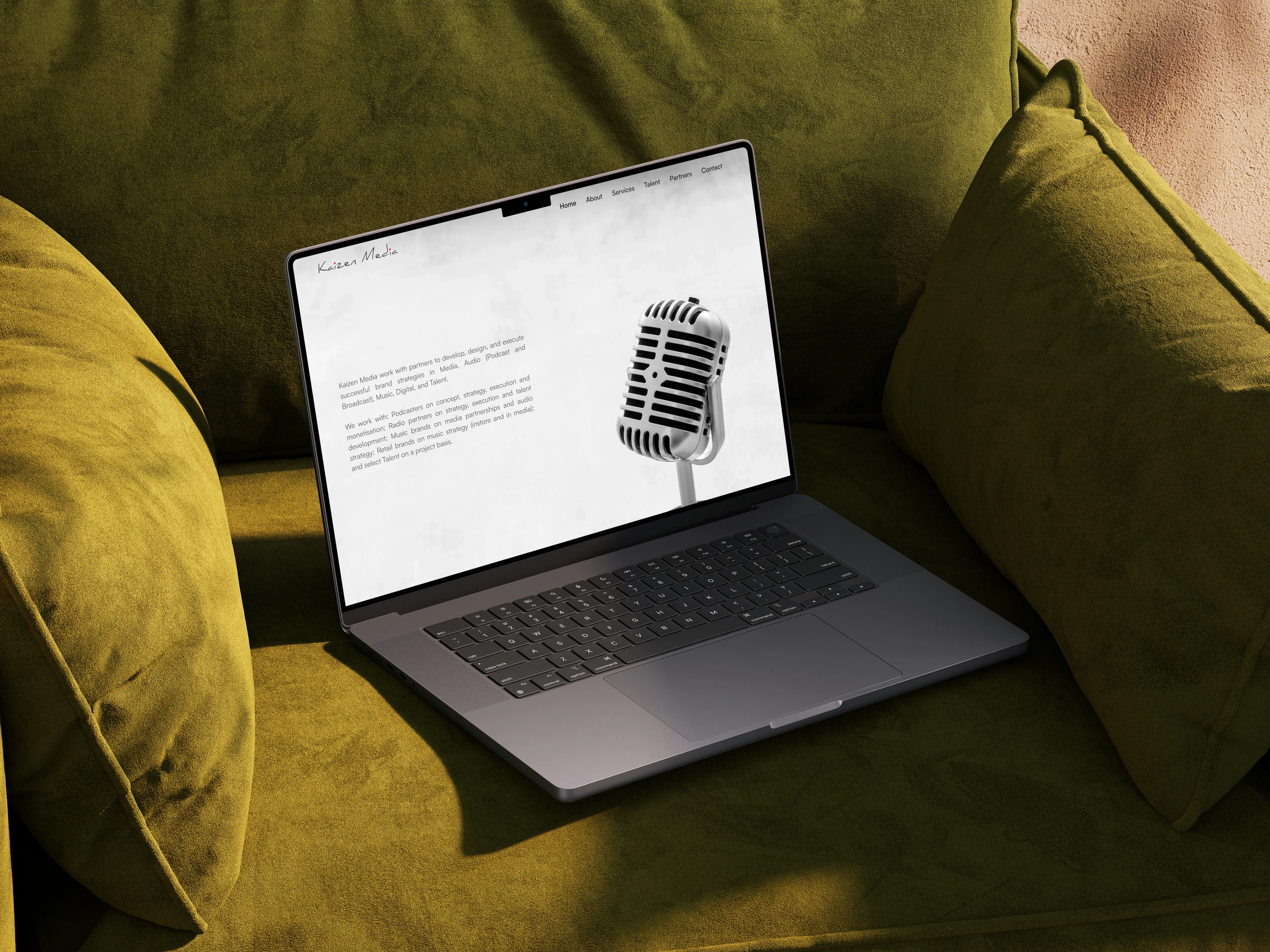 Kaizen Media website on a laptop