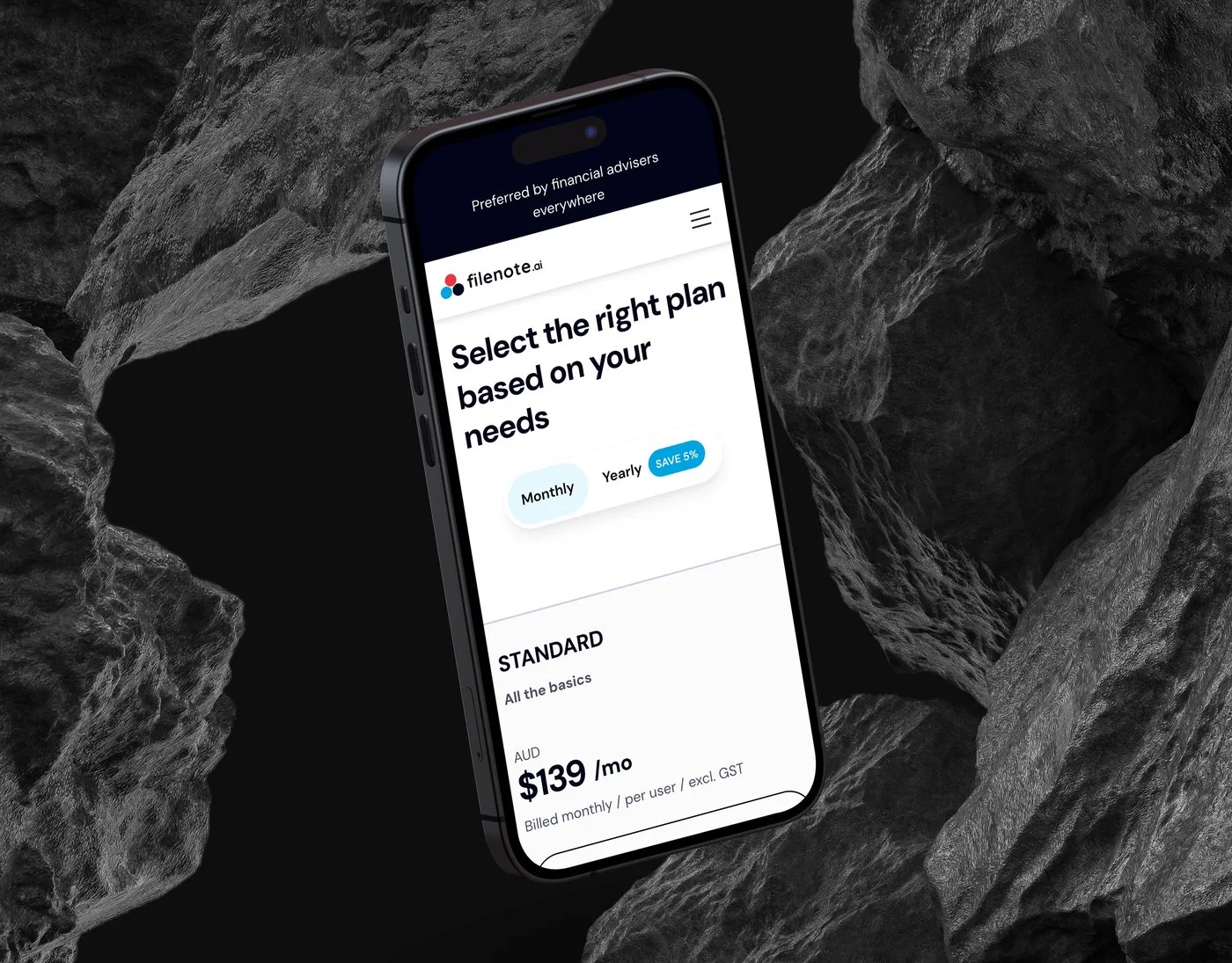 The Filenote.ai pricing page on an iPhone angled among dark volcanic rocks — "Select the right plan based on your needs" above the Standard plan and its monthly pricing.