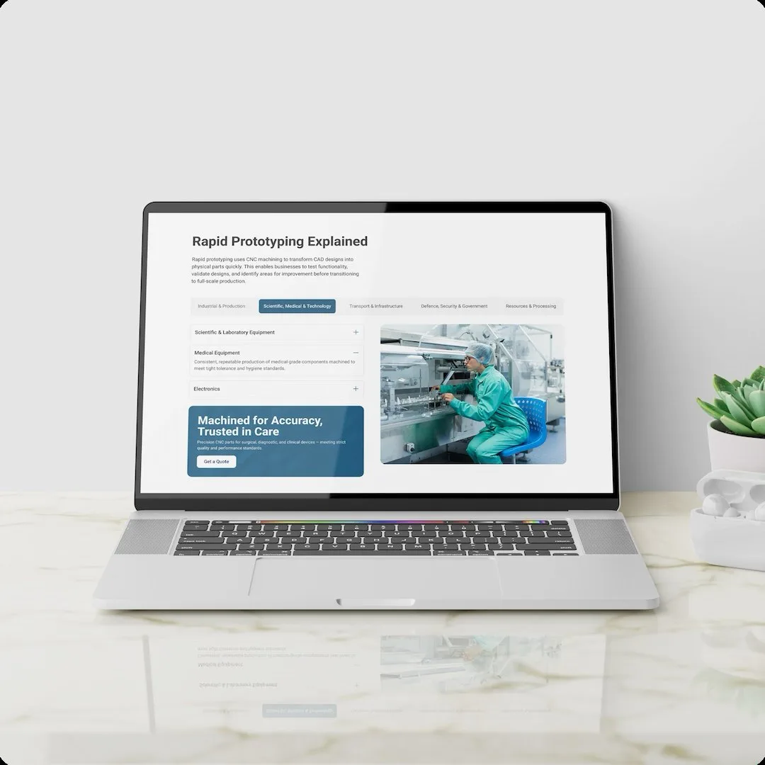 The Southside Engineering Rapid Prototyping Explained page on a laptop on a marble desk beside a succulent and an earbuds case, with the industry tabs open on Medical Equipment and a Machined for Accuracy, Trusted in Care callout.