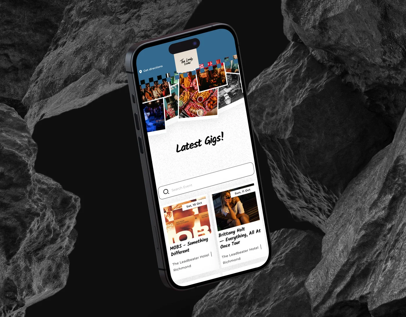 The Leadbeater Hotel gig guide on an iPhone angled among dark volcanic rocks: the Latest Gigs heading, the event search and the first gig cards.